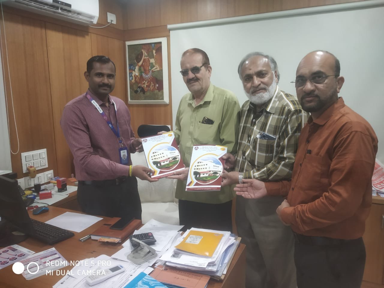Behalf of Principal Dr. Mazhar Ahamad Farooqui, Alumni Association  of Azad College,  Working president Mr. Akhtar Khan, Seretary Prof. Rafiuddin Naser and Dr. Ansari Md. Ilyas  Presenting latest College Magazine to  Manager of SBI Rauza Bagh, to Mr. Pramod Patil.
