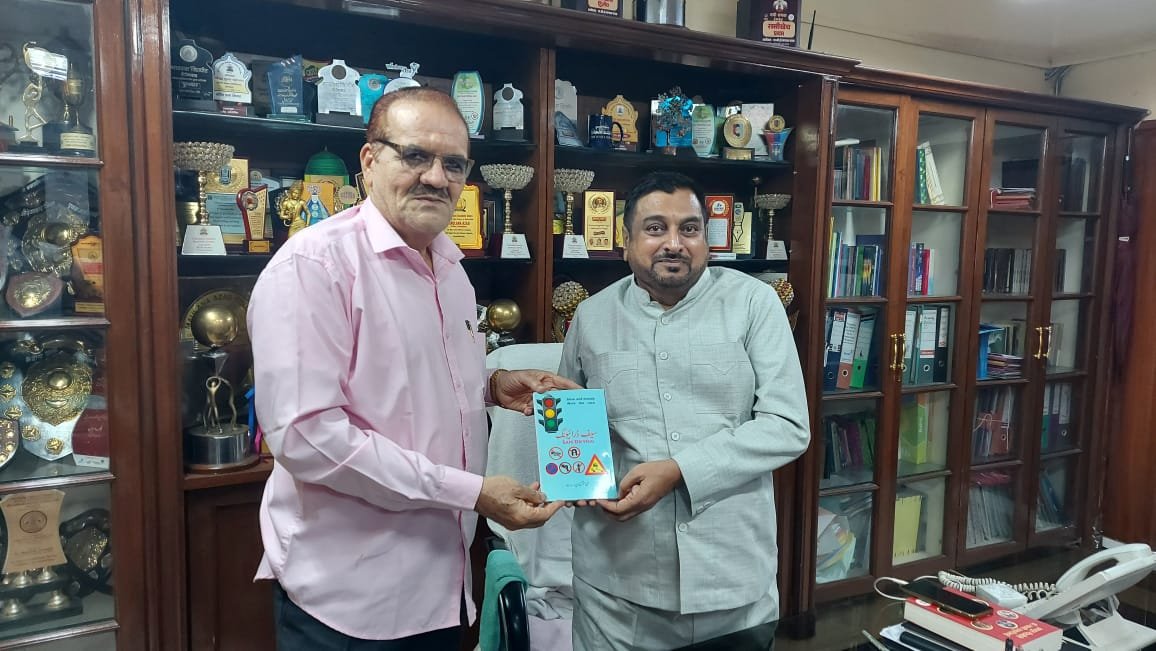 Akhtar Khan, President of the Alumni Association of Azad College, presented his newly authored book 